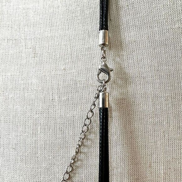 Round silver tone pendant necklace on long black cord - Picture 6 of 10